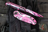 Microtech LUDT OTS Knife- Smooth Body- Tanto Edge- Pink With Black And Blue Splatter Finished Handle And Plain Edge Blade 1136S-1BKPK-LBSPLS
