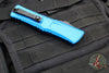 Microtech Combat Troodon Gen III OTF Knife- Double Edge- Blue Handle- Black Part Serrated Edge Blade 1142-2 BL Gen III