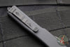 Microtech UTX-70 OTF Knife- Warhound Edge- Shadow- Black Handle With Deep Etched Logo- Black DLC Plain Edge Blade 419W-1 DLCTSH