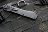 Heretic Manticore-X OTF Auto- Double Edge- Tactical- Black Frag Pattern Handle- Two-Tone Black Full Serrated Blade- Black HW H032F-10C-T