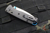 Benchmade Mini Bugout- Carbon Fiber Handle- Stonewash Plain Edge- Blue Thumbstud and Backspacer 533-3